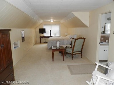 Nestled near the scenic Western Golf Course, this beautifully on Western Golf and Country Club in Michigan - for sale on GolfHomes.com, golf home, golf lot