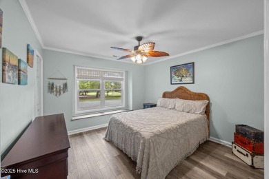 Enjoy captivating water views from nearly every room in this on Harbour Point Golf Club in North Carolina - for sale on GolfHomes.com, golf home, golf lot