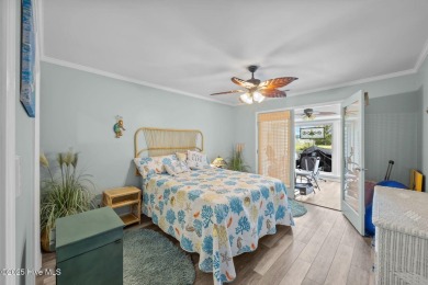 Enjoy captivating water views from nearly every room in this on Harbour Point Golf Club in North Carolina - for sale on GolfHomes.com, golf home, golf lot