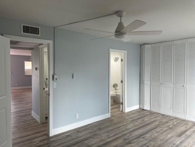 Renovated Waterfront Villa! Freshly painted, vinyl wood flooring on Kings Point Golf -Flanders Way in Florida - for sale on GolfHomes.com, golf home, golf lot