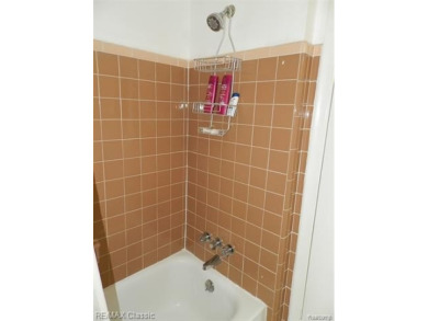 Nestled near the scenic Western Golf Course, this beautifully on Western Golf and Country Club in Michigan - for sale on GolfHomes.com, golf home, golf lot