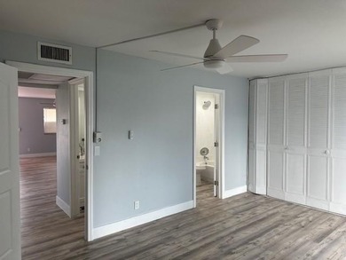 Renovated Waterfront Villa! Freshly painted, vinyl wood flooring on Kings Point Golf -Flanders Way in Florida - for sale on GolfHomes.com, golf home, golf lot