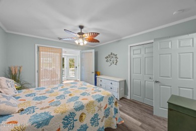 Enjoy captivating water views from nearly every room in this on Harbour Point Golf Club in North Carolina - for sale on GolfHomes.com, golf home, golf lot