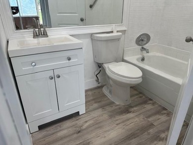 Renovated Waterfront Villa! Freshly painted, vinyl wood flooring on Kings Point Golf -Flanders Way in Florida - for sale on GolfHomes.com, golf home, golf lot