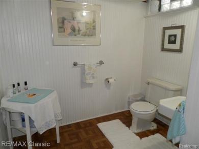 Nestled near the scenic Western Golf Course, this beautifully on Western Golf and Country Club in Michigan - for sale on GolfHomes.com, golf home, golf lot