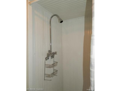 Nestled near the scenic Western Golf Course, this beautifully on Western Golf and Country Club in Michigan - for sale on GolfHomes.com, golf home, golf lot