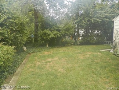 Nestled near the scenic Western Golf Course, this beautifully on Western Golf and Country Club in Michigan - for sale on GolfHomes.com, golf home, golf lot