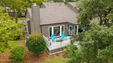 Enjoy captivating water views from nearly every room in this on Harbour Point Golf Club in North Carolina - for sale on GolfHomes.com, golf home, golf lot
