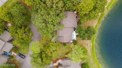 Enjoy captivating water views from nearly every room in this on Harbour Point Golf Club in North Carolina - for sale on GolfHomes.com, golf home, golf lot