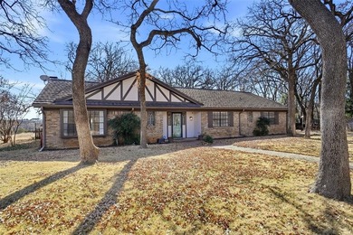 ONE STORY ENGLISH TUDOR SYLE HOME, LOCATED IN SOUGHT AFTER on Woodhaven Country Club in Texas - for sale on GolfHomes.com, golf home, golf lot