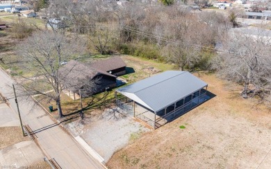 Looking for some extra space without leaving town? This property on Cherokee Creek Golf Club in Arkansas - for sale on GolfHomes.com, golf home, golf lot