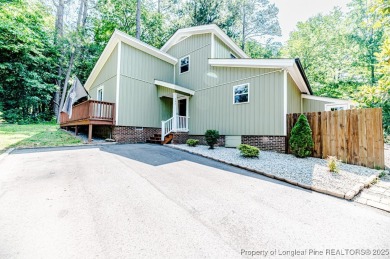 Seller has outgrown this beautifully updated 2-bedroom on Carolina Trace Country Club in North Carolina - for sale on GolfHomes.com, golf home, golf lot