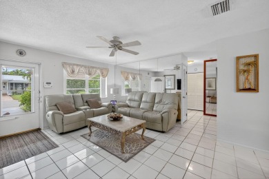 Welcome to this stunning 2-bedroom, 2-bathroom corner home on Leisureville Community Association in Florida - for sale on GolfHomes.com, golf home, golf lot
