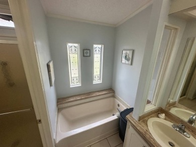This 2-bedroom, 2 bathrooms Palm Harbor home is located on the on Del Tura Golf and Country Club in Florida - for sale on GolfHomes.com, golf home, golf lot