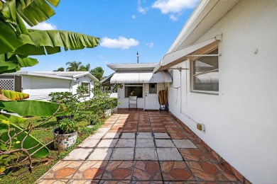 Welcome to this stunning 2-bedroom, 2-bathroom corner home on Leisureville Community Association in Florida - for sale on GolfHomes.com, golf home, golf lot