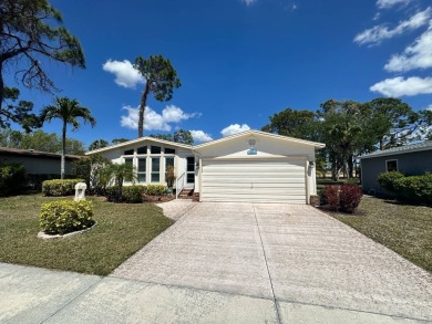 This 2-bedroom, 2 bathrooms Palm Harbor home is located on the on Del Tura Golf and Country Club in Florida - for sale on GolfHomes.com, golf home, golf lot