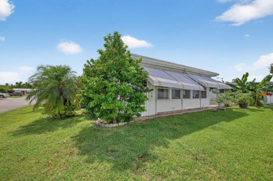 Welcome to this stunning 2-bedroom, 2-bathroom corner home on Leisureville Community Association in Florida - for sale on GolfHomes.com, golf home, golf lot