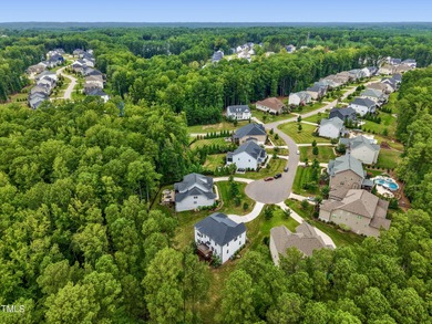 Behind the gates of Hasentree Country Golf Club community on Hasentree Club in North Carolina - for sale on GolfHomes.com, golf home, golf lot