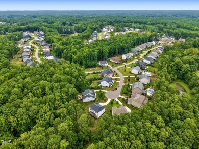 Behind the gates of Hasentree Country Golf Club community on Hasentree Club in North Carolina - for sale on GolfHomes.com, golf home, golf lot