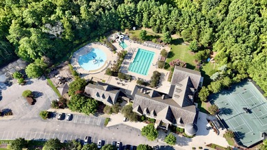 Behind the gates of Hasentree Country Golf Club community on Hasentree Club in North Carolina - for sale on GolfHomes.com, golf home, golf lot