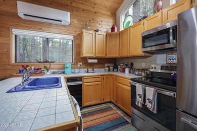 Cozy mountain retreat on a huge, heavily treed, large 36,600 sq on Pinewood Country Club in Arizona - for sale on GolfHomes.com, golf home, golf lot