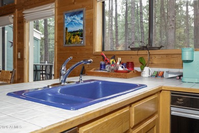 Cozy mountain retreat on a huge, heavily treed, large 36,600 sq on Pinewood Country Club in Arizona - for sale on GolfHomes.com, golf home, golf lot