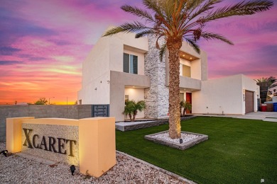 Welcome to this modern contemporary home in the sought-after on Cocopah Rio Colorado Golf Course in Arizona - for sale on GolfHomes.com, golf home, golf lot