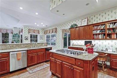 Enjoy the peaceful enlarged screen porch of this classic Belfair on Belfair Golf Club in South Carolina - for sale on GolfHomes.com, golf home, golf lot