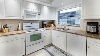 Enjoying enhanced privacy, serenity, and abundant natural light on Inverrary Country Club in Florida - for sale on GolfHomes.com, golf home, golf lot