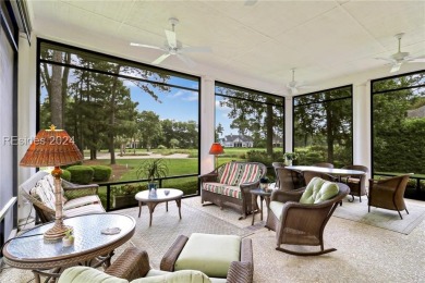 Enjoy the peaceful enlarged screen porch of this classic Belfair on Belfair Golf Club in South Carolina - for sale on GolfHomes.com, golf home, golf lot