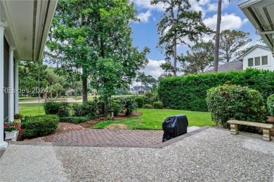 Enjoy the peaceful enlarged screen porch of this classic Belfair on Belfair Golf Club in South Carolina - for sale on GolfHomes.com, golf home, golf lot