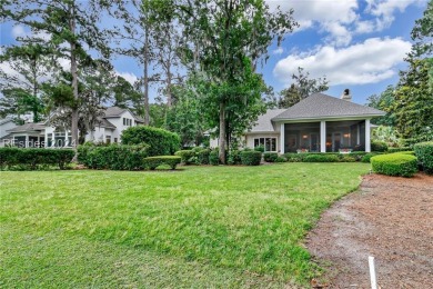 Enjoy the peaceful enlarged screen porch of this classic Belfair on Belfair Golf Club in South Carolina - for sale on GolfHomes.com, golf home, golf lot