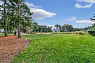 Enjoy the peaceful enlarged screen porch of this classic Belfair on Belfair Golf Club in South Carolina - for sale on GolfHomes.com, golf home, golf lot