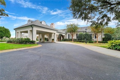 Enjoy the peaceful enlarged screen porch of this classic Belfair on Belfair Golf Club in South Carolina - for sale on GolfHomes.com, golf home, golf lot