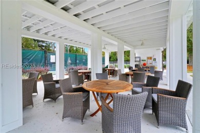 Enjoy the peaceful enlarged screen porch of this classic Belfair on Belfair Golf Club in South Carolina - for sale on GolfHomes.com, golf home, golf lot