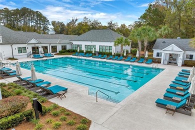 Enjoy the peaceful enlarged screen porch of this classic Belfair on Belfair Golf Club in South Carolina - for sale on GolfHomes.com, golf home, golf lot