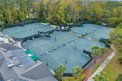 Enjoy the peaceful enlarged screen porch of this classic Belfair on Belfair Golf Club in South Carolina - for sale on GolfHomes.com, golf home, golf lot