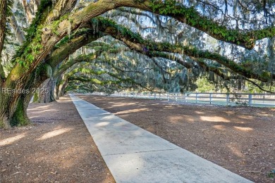 Enjoy the peaceful enlarged screen porch of this classic Belfair on Belfair Golf Club in South Carolina - for sale on GolfHomes.com, golf home, golf lot