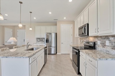 JUST REDUCED $20K - Assumable 3.25% VA Loan! Move-In Ready on Seminole Lakes Country Club in Florida - for sale on GolfHomes.com, golf home, golf lot