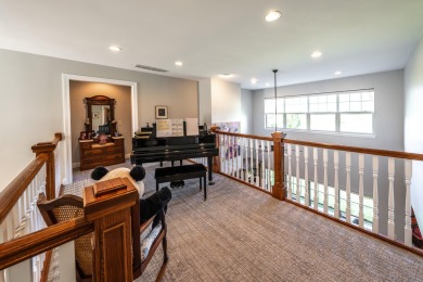 Crafted by Lowell Custom Homes this Geneva National townhome on Geneva National Golf Club in Wisconsin - for sale on GolfHomes.com, golf home, golf lot