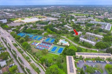 Welcome to your slice of paradise in the heart of Pompano Beach! on Wynmoor Golf Course in Florida - for sale on GolfHomes.com, golf home, golf lot