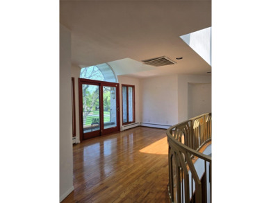 A GRANITE STONE MANSION FULL OF NATURAL SUNLIGHT / CUSTOM BUILT on Lake Success Golf Club in New York - for sale on GolfHomes.com, golf home, golf lot