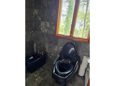 A GRANITE STONE MANSION FULL OF NATURAL SUNLIGHT / CUSTOM BUILT on Lake Success Golf Club in New York - for sale on GolfHomes.com, golf home, golf lot