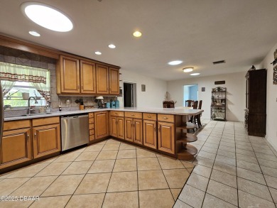 Spacious and versatile, this nearly 3,000 sq ft home is perfect on Riviera Country Club in Florida - for sale on GolfHomes.com, golf home, golf lot