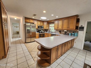 Spacious and versatile, this nearly 3,000 sq ft home is perfect on Riviera Country Club in Florida - for sale on GolfHomes.com, golf home, golf lot
