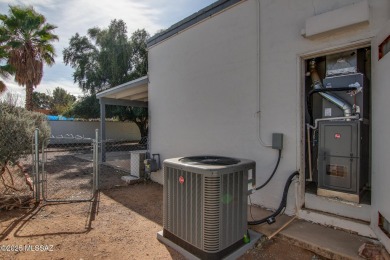 This light-filled 2-bedroom, 1-bathroom home offers stunning on Quail Creek Country Club  in Arizona - for sale on GolfHomes.com, golf home, golf lot