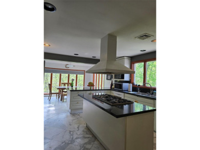 A GRANITE STONE MANSION FULL OF NATURAL SUNLIGHT / CUSTOM BUILT on Lake Success Golf Club in New York - for sale on GolfHomes.com, golf home, golf lot