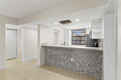 Beautiful 2-bedroom, 2-bathroom condo with a versatile bonus on Pine Island Ridge Country Club in Florida - for sale on GolfHomes.com, golf home, golf lot