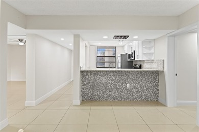 Beautiful 2-bedroom, 2-bathroom condo with a versatile bonus on Pine Island Ridge Country Club in Florida - for sale on GolfHomes.com, golf home, golf lot