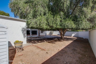 This light-filled 2-bedroom, 1-bathroom home offers stunning on Quail Creek Country Club  in Arizona - for sale on GolfHomes.com, golf home, golf lot